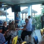 Chris Busch teaching a Credit 101 for Real Estate class at a waterfront venue in Seabrook Texas
